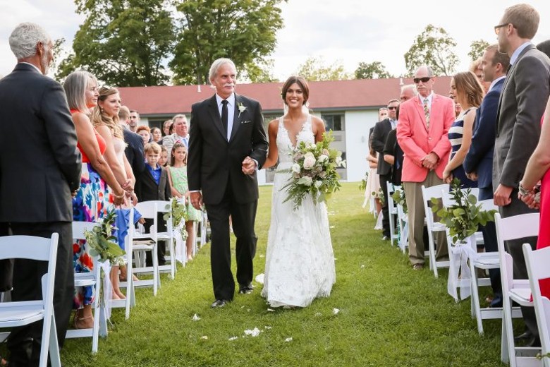 bride and her father walking down aisle