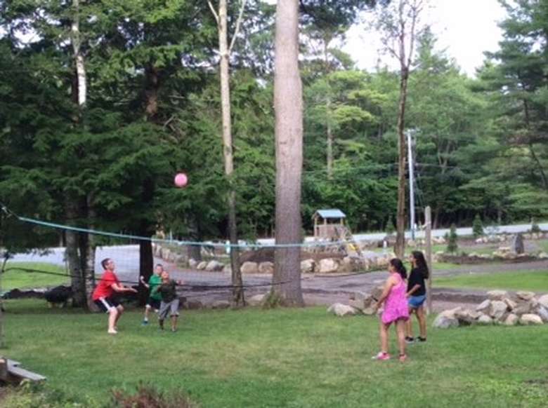 young people playing volleyball