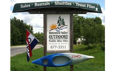 battenkill valley outdoors sign with a kayak mounted to it