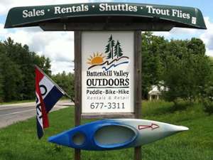 battenkill valley outdoors sign with a kayak mounted to it