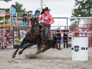 cowgirl riding a horse
