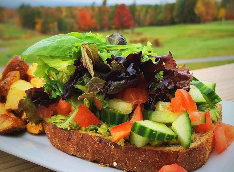 a slice of toast with veggies on it