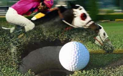 Horses racing in the background with a golf ball and cup in the foreground