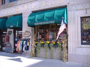 exterior of impressions of saratoga with a rack of clothes outside