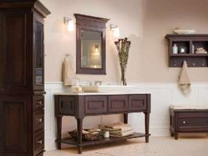 brown cabinet, table, and decor in a room