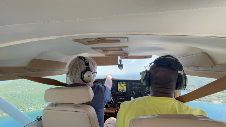two people fly plane