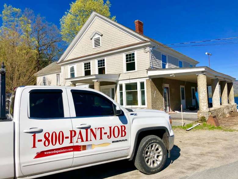 paint job truck in front of house