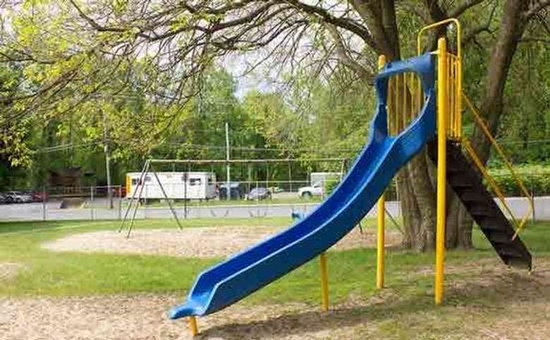 Slide with swings in the background