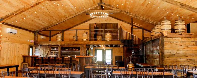 tables and bar in a rustic barn
