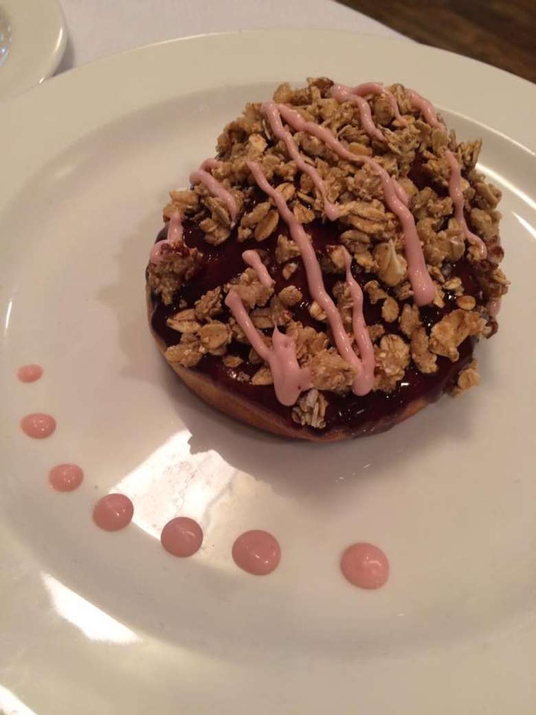 tart with an oatmeal crumble and pink sauce