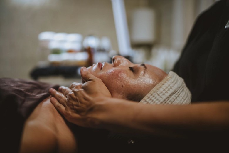 a woman receiving a neck massage