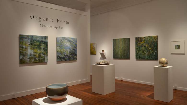 art gallery showing the organic form exhibition with sculptures and paintings on the walls