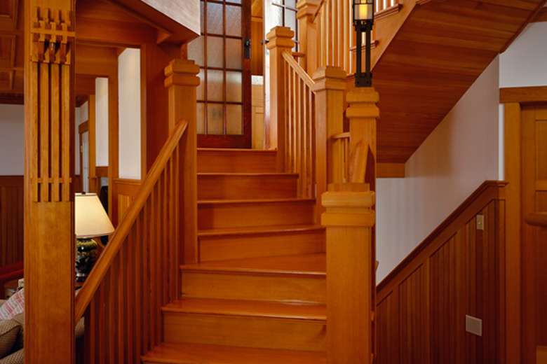 wooden staircase leading to the upstairs of a home