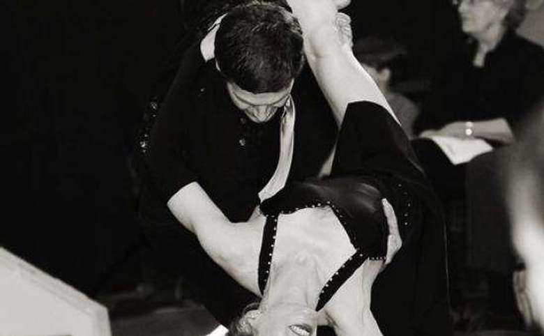 man dipping a woman during a ballroom dance performance