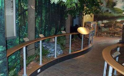 museum walkway with informational panels along the railing