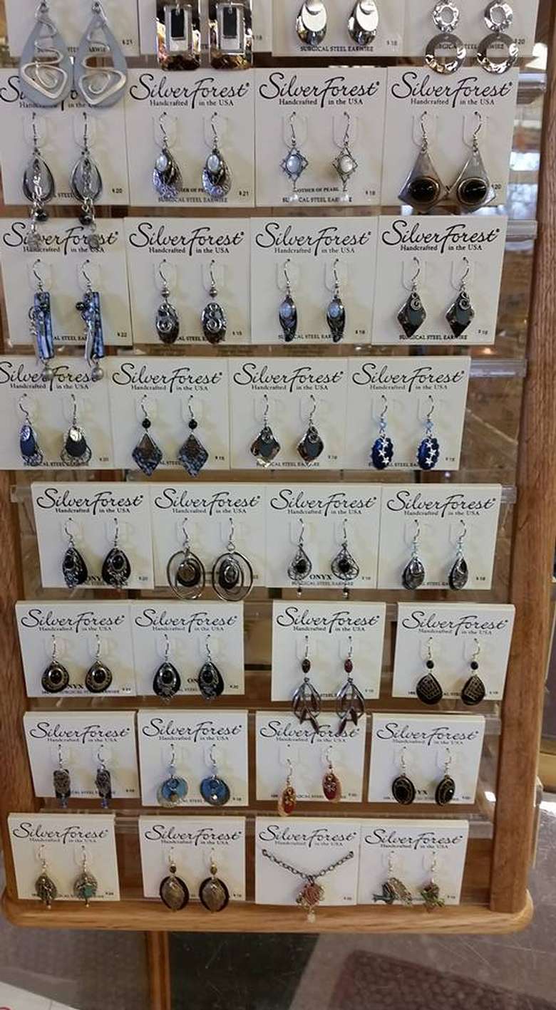 a display of several pairs of earrings