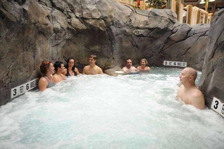 group of adults in a hot tub