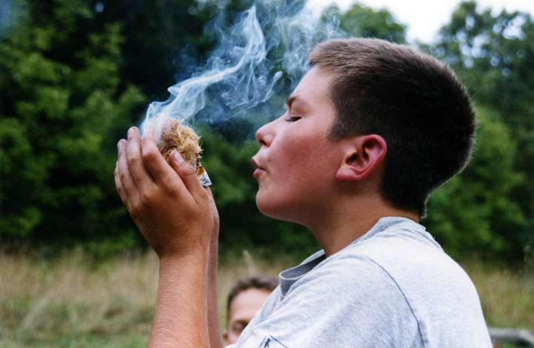 kid blowing smoke