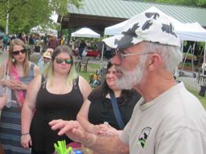 a bearded man talking as he takes the group on a tour