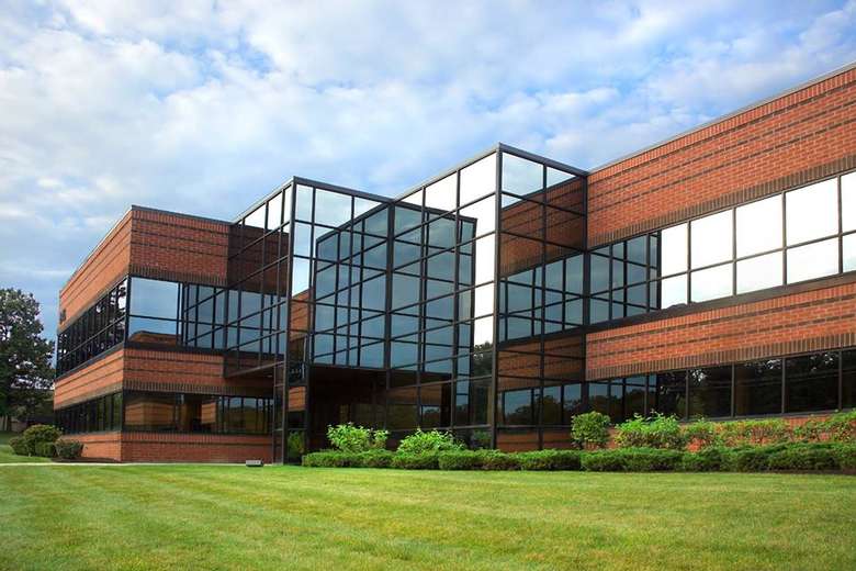 a large office building with big glass windows