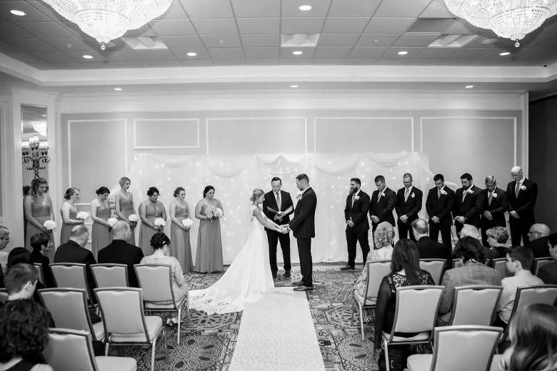 black and white photo of an indoor ceremony