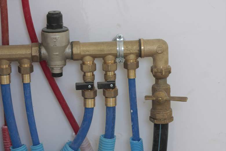 blue tubes and pipes connected to a larger system
