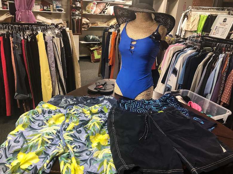 bathing suit and clothing on display in store