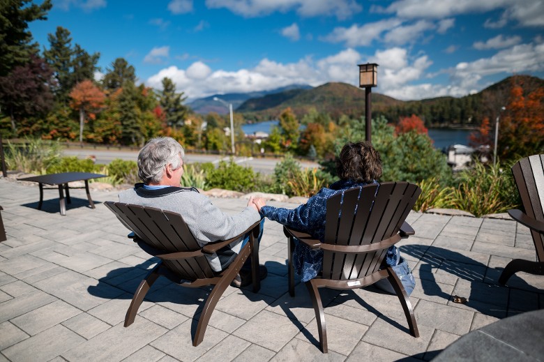 couple on deck look at view