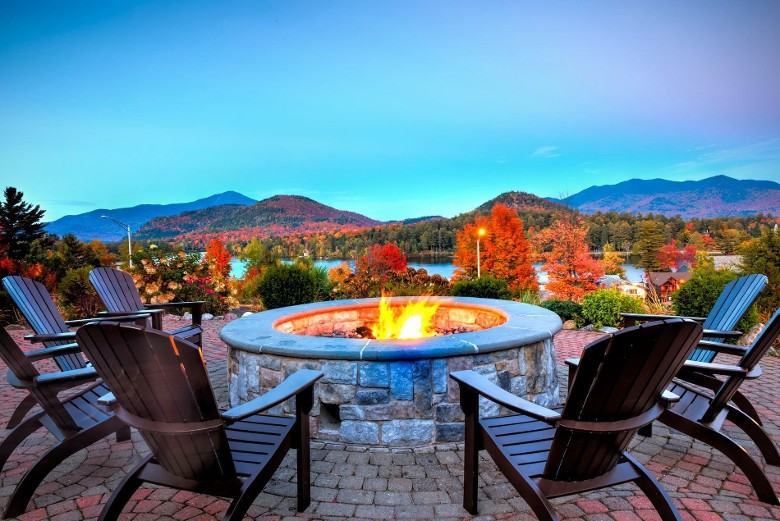 outdoor fire pit surrounded by fall foliage