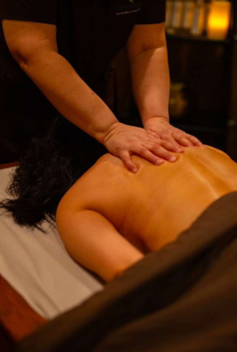 client receiving back massage