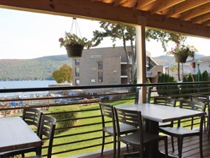 an outdoor patio with tables and chairs