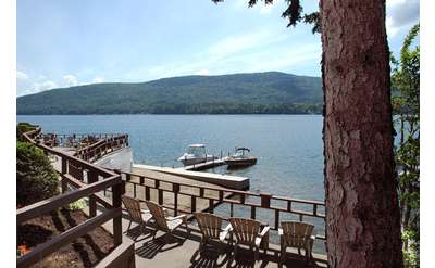 adirondack chairs on a deck overlooking lake george