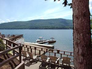 adirondack chairs on a deck overlooking lake george