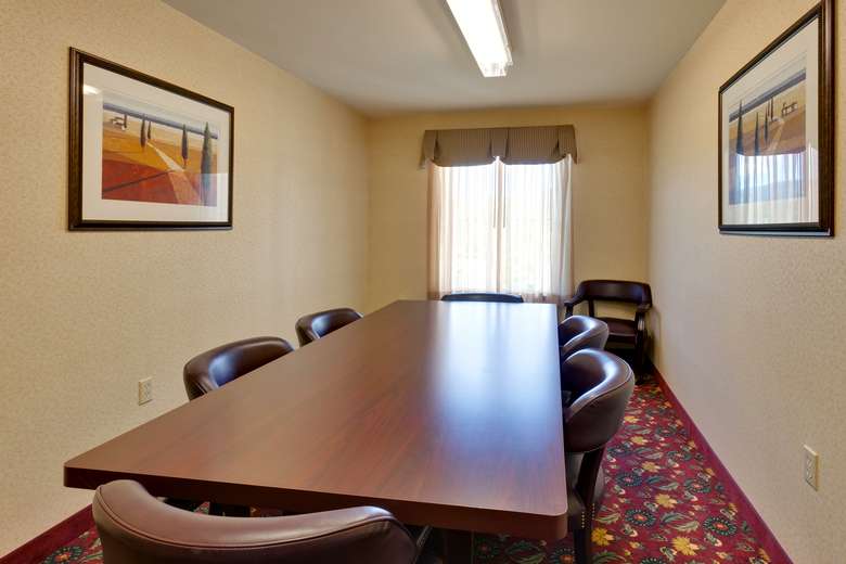 table with six chairs in a conference room