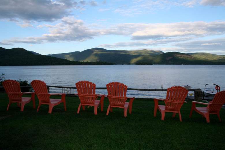 view the lake and mountains from Adirondack chairs