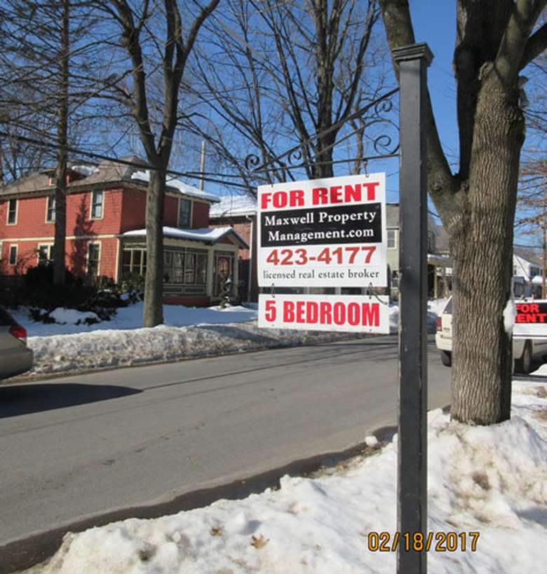 for rent sign on a sunny winter day