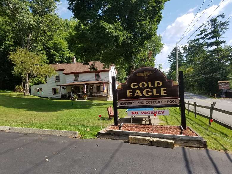 the sign for Gold Eagle housekeeping cottages