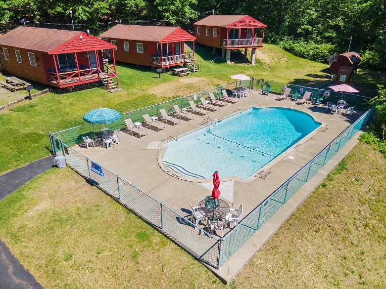 red cottages near an outdoor pool