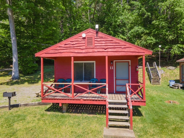red cottage with deck