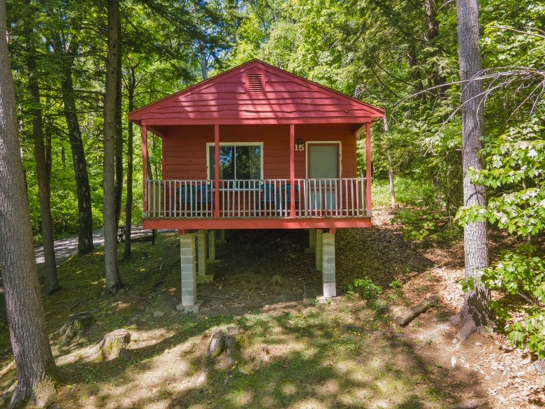 red cottage with deck
