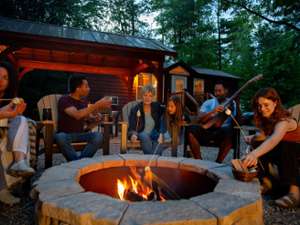 Group of guests outside a cabin