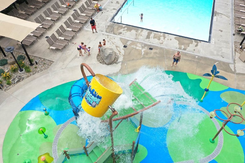 Cascade Cove Splash Pad bucket dumps every 90 - 120 seconds.