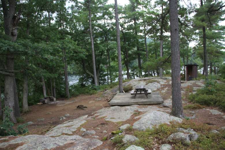 a tent platform with a picnic table on it