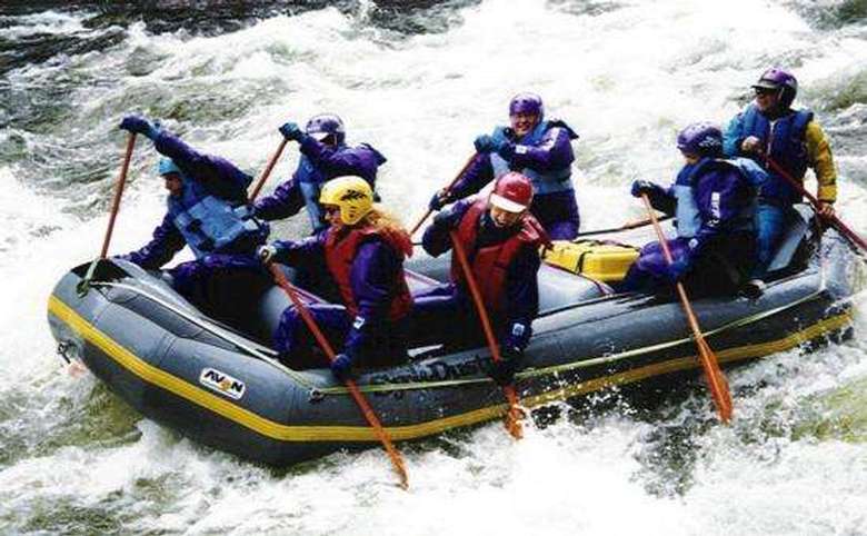 a group white water rafting