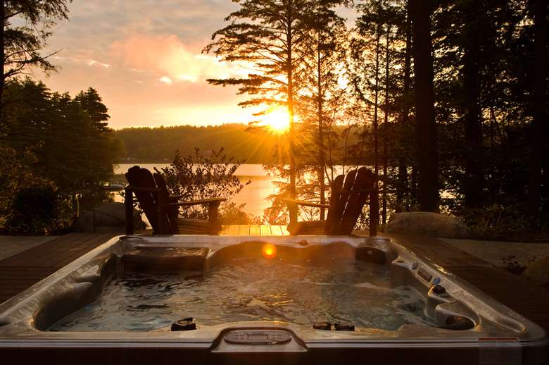 a sunset and a hot tub