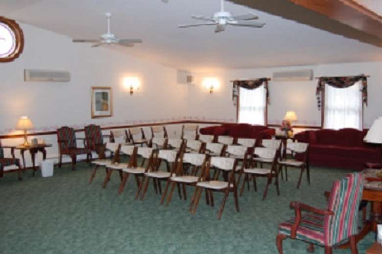 Chairs and couches facing the front of the room