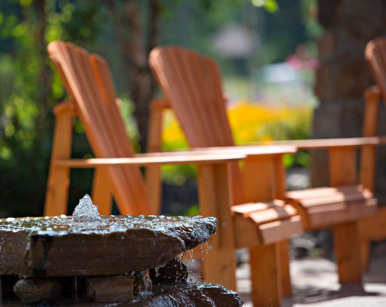 two adirondack chairs in outdoor seating area