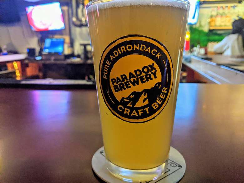 beer in a glass that says paradox brewery