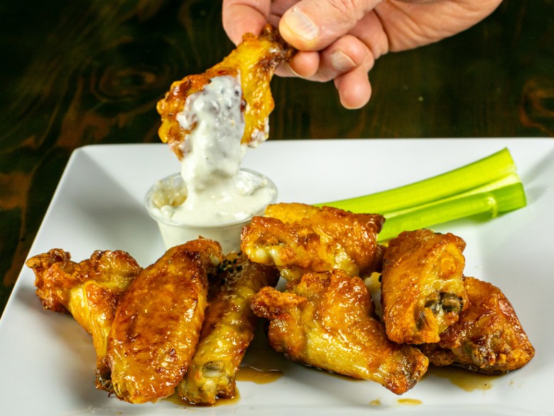 Chicken wings with dipping sauce at Artisanal Brew Works restaurant in Saratoga Springs NY