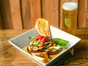 Elevated bistro-style dish paired with craft beer at Artisanal Brew Works restaurant in Saratoga Springs, NY.